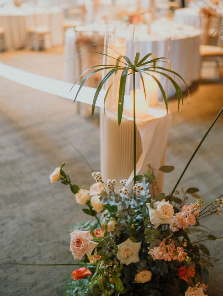 Pleated pedestal stands and florals lining for a wedding at the Capella Hotel Singapore aisle.