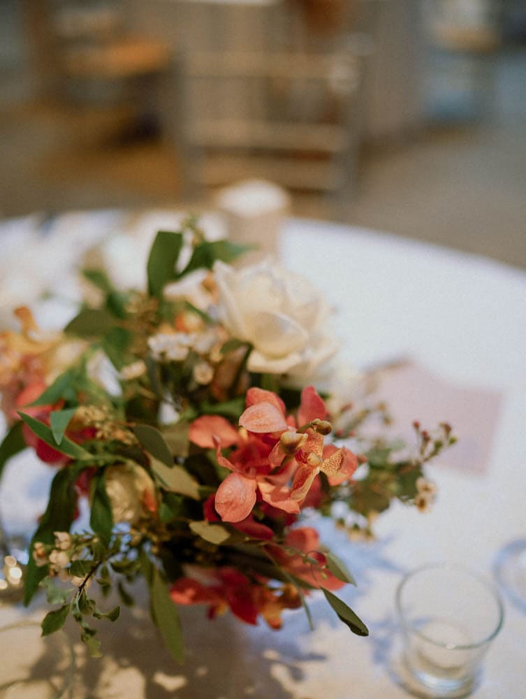 Tablecenter florals in blush and white tones styled organically at Capella Hotel Singapore.