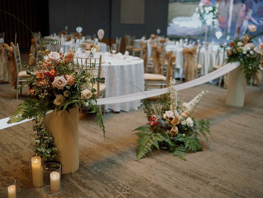 Low pedestal of tropical wedding aisle at Capella Hotel Singapore.