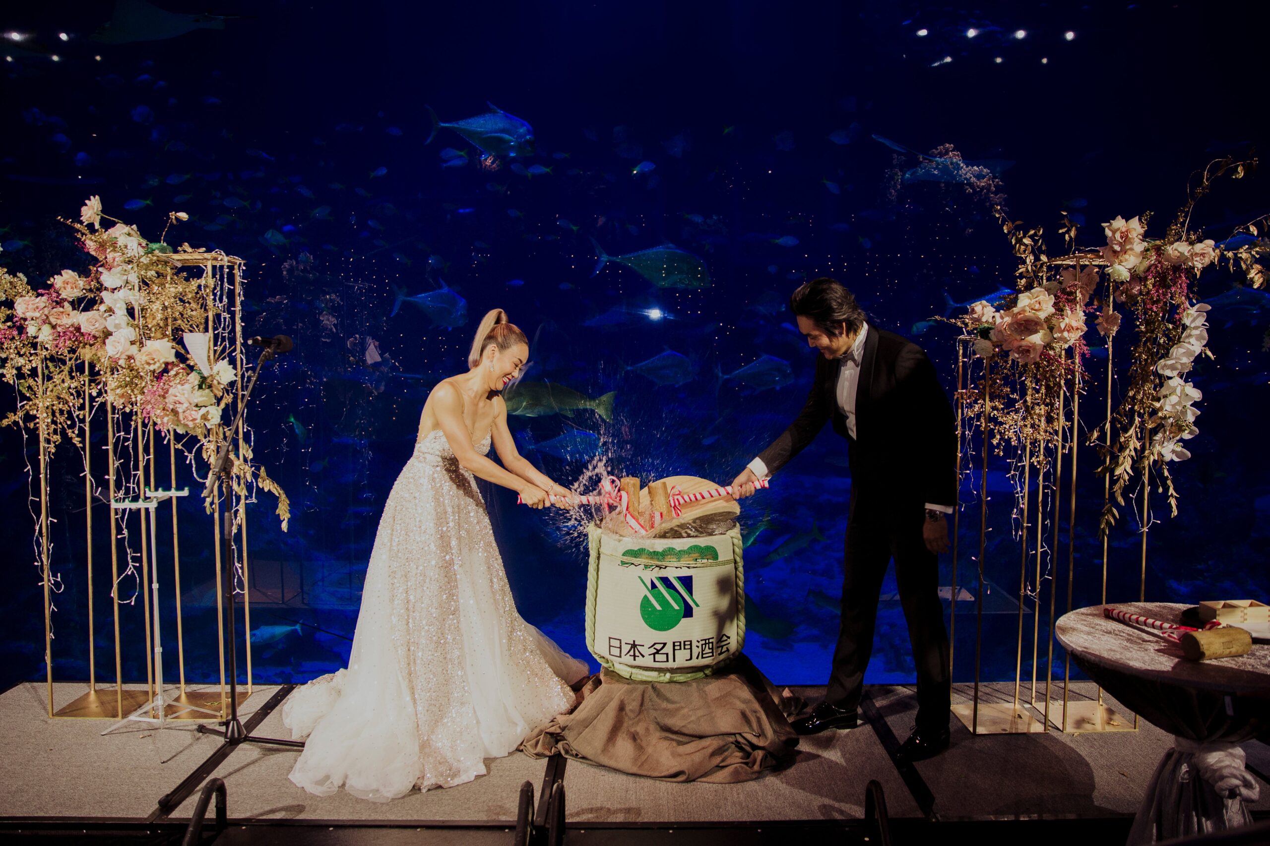 Japanese wedding tradition of kagami-biraki with wooden mallet at SEA Aquarium Resorts World Sentosa Singapore marine life