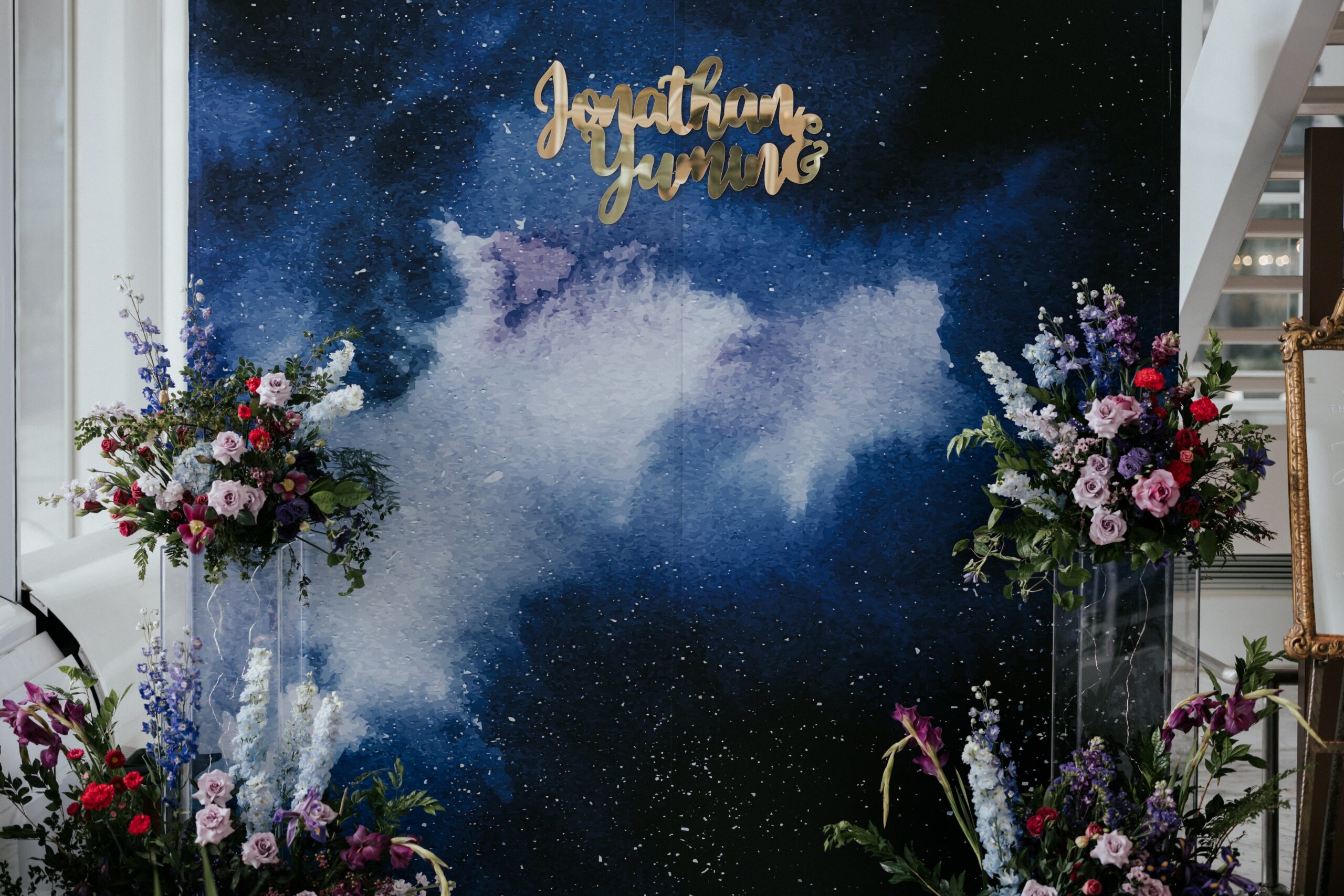 On day wedding photography price of starry backdrop for guests' photobooth phototaking with flower decorations at JW Marriott Singapore Hotel