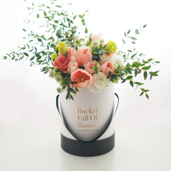 Wild flowers roses floral arrangement bucket