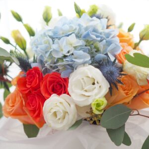 Wild flowers roses floral arrangement bucket