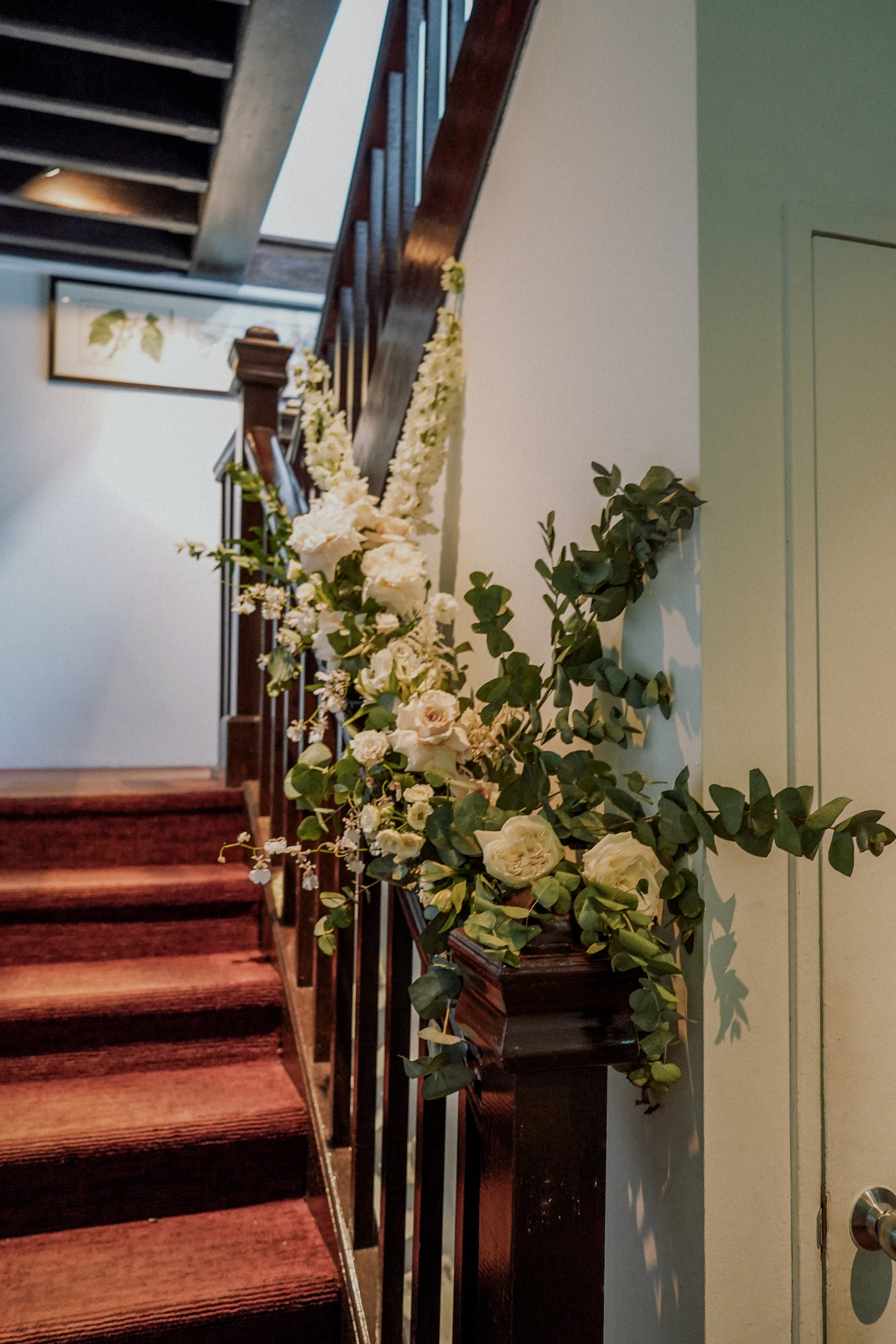Wedding staircase garland decorating ideas for simple wedding decoration at Corner House Singapore