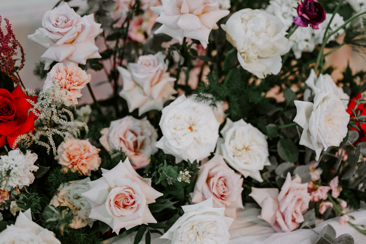 Close up of white carnations and red roses wedding floral decor ideas Singapore wedding 2022