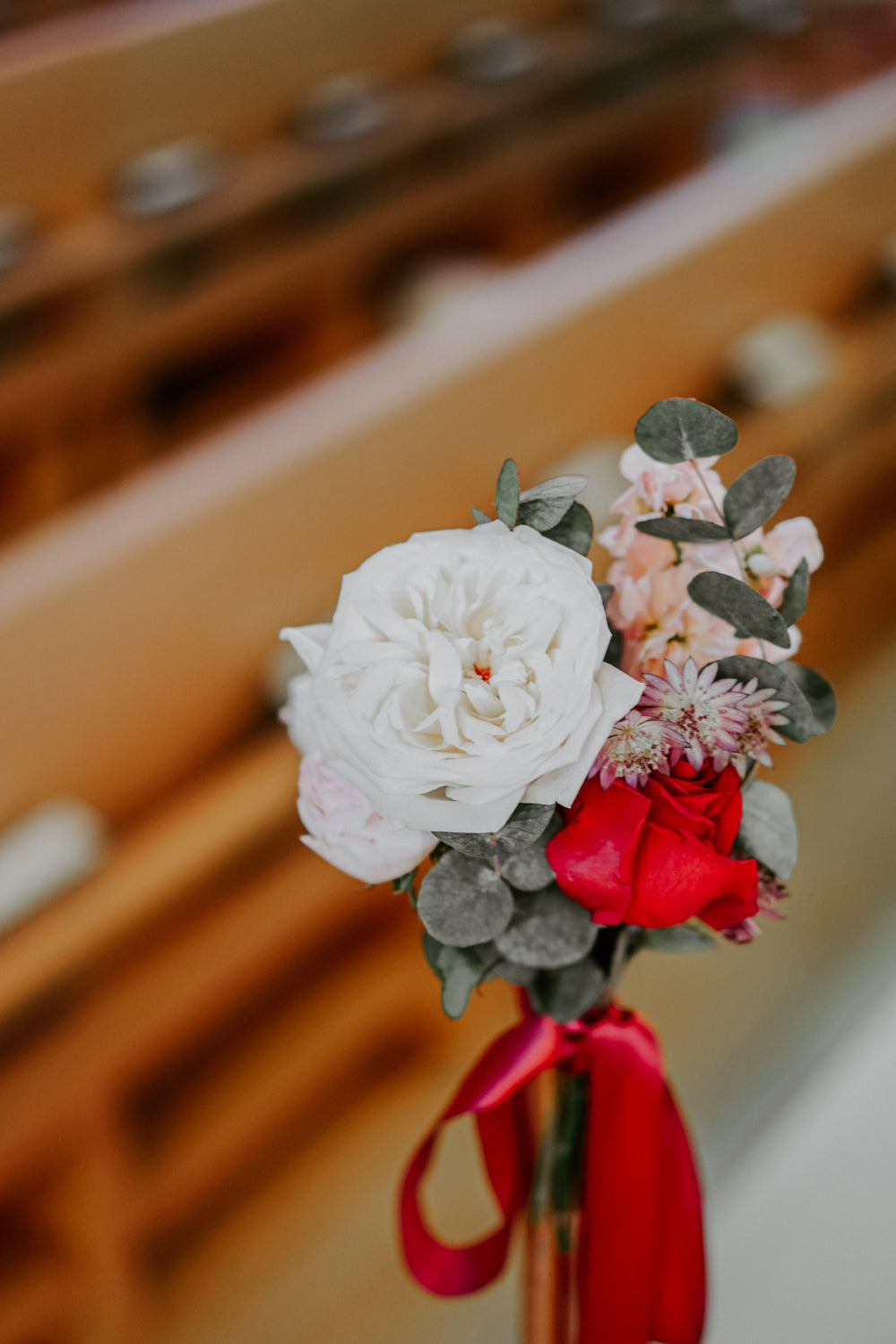 Delicate small flower bouquet for church pew with red ribbon at Singapore church ceremony