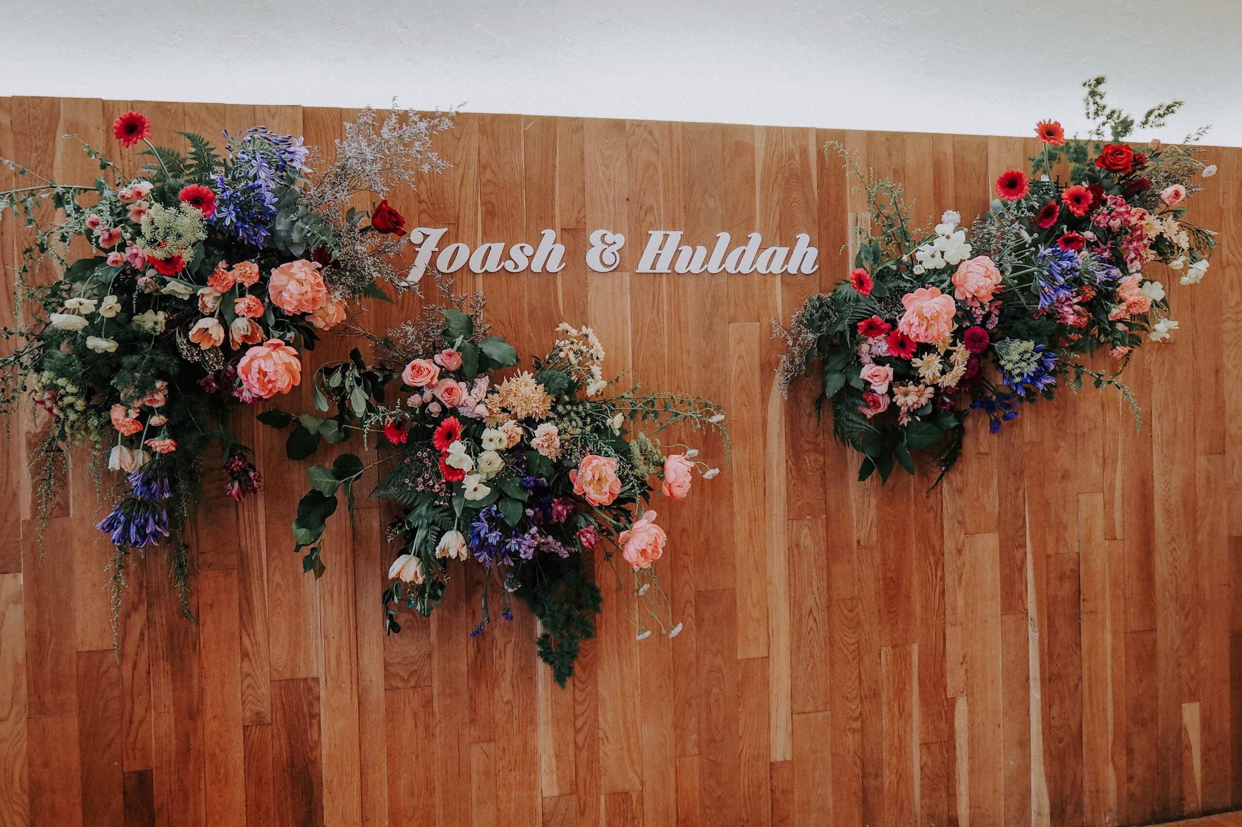Organic floral installation on wall for wedding reception at Dempsey Hill White Rabbit restaurant