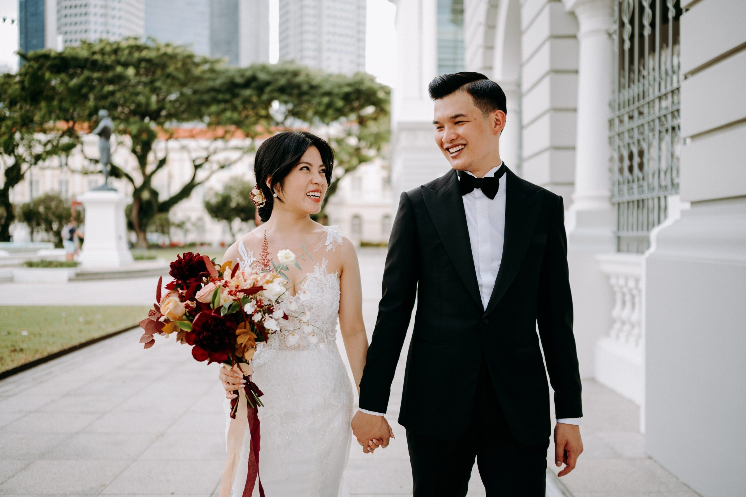Singapore wedding couple photography at Victoria Concert Hall in bridal gown and suit