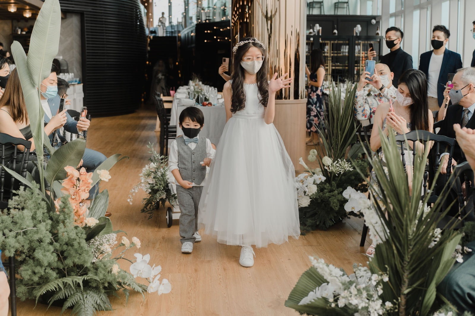 Flower girl walking down the wedding aisle inspiration at Nicole Chang Min wedding venue Singapore restaurant 1 Atico