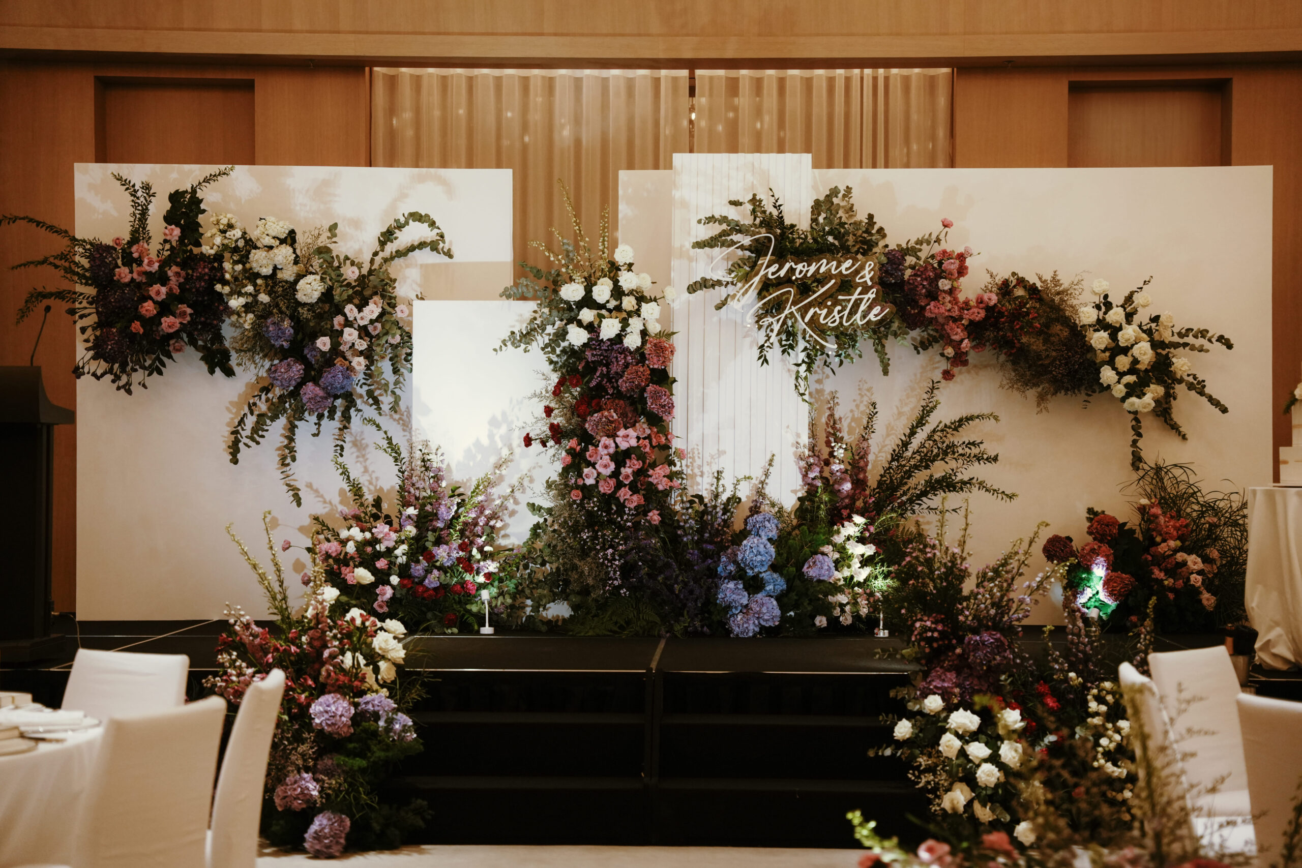 Modern floral ceremony design with soft purples, violet, and white at Edition Hotel Singapore.