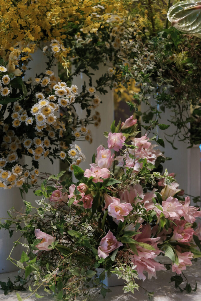 Close up shot of soft pastel floral tower styled for corporate event ambiance at Resorts World Sentosa hotel.