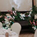 Thumbnail showing pink and white tropical floral stage setup, Raffles Hotel wedding.