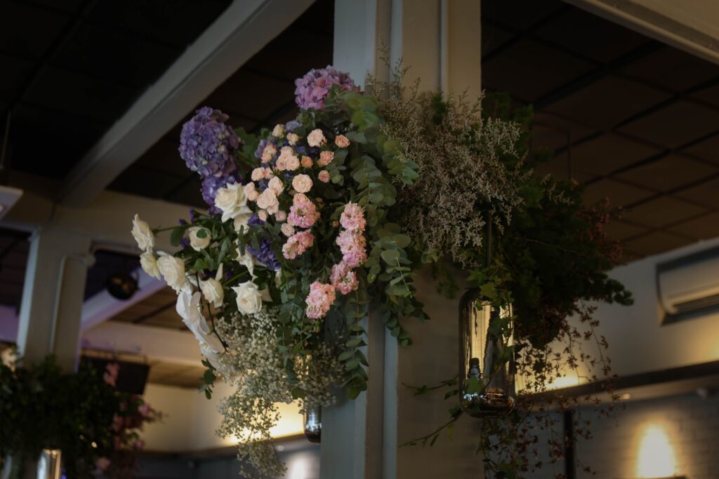 column floral arrangement featuring purple hydrangeas and organic foliage for modern intimate wedding styling at The Blackbird, Singapore