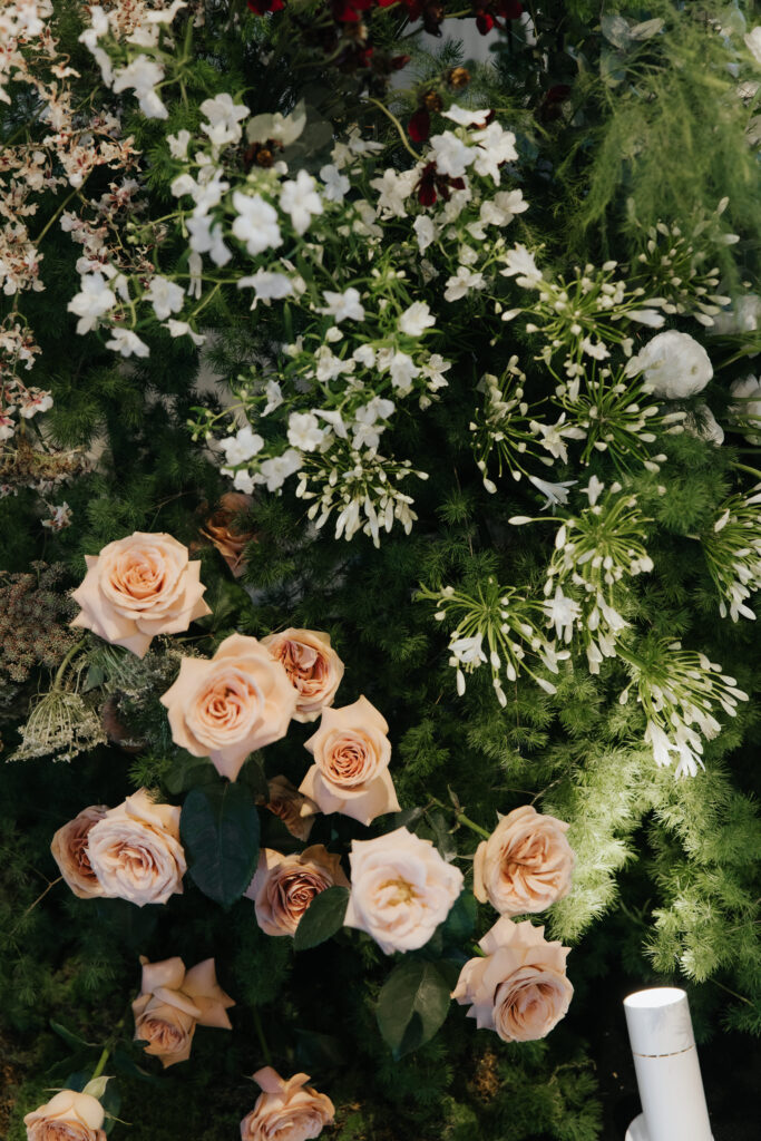 Textural wild organic flowers with blush roses and layered greenery in antique garden style at Andaz Singapore