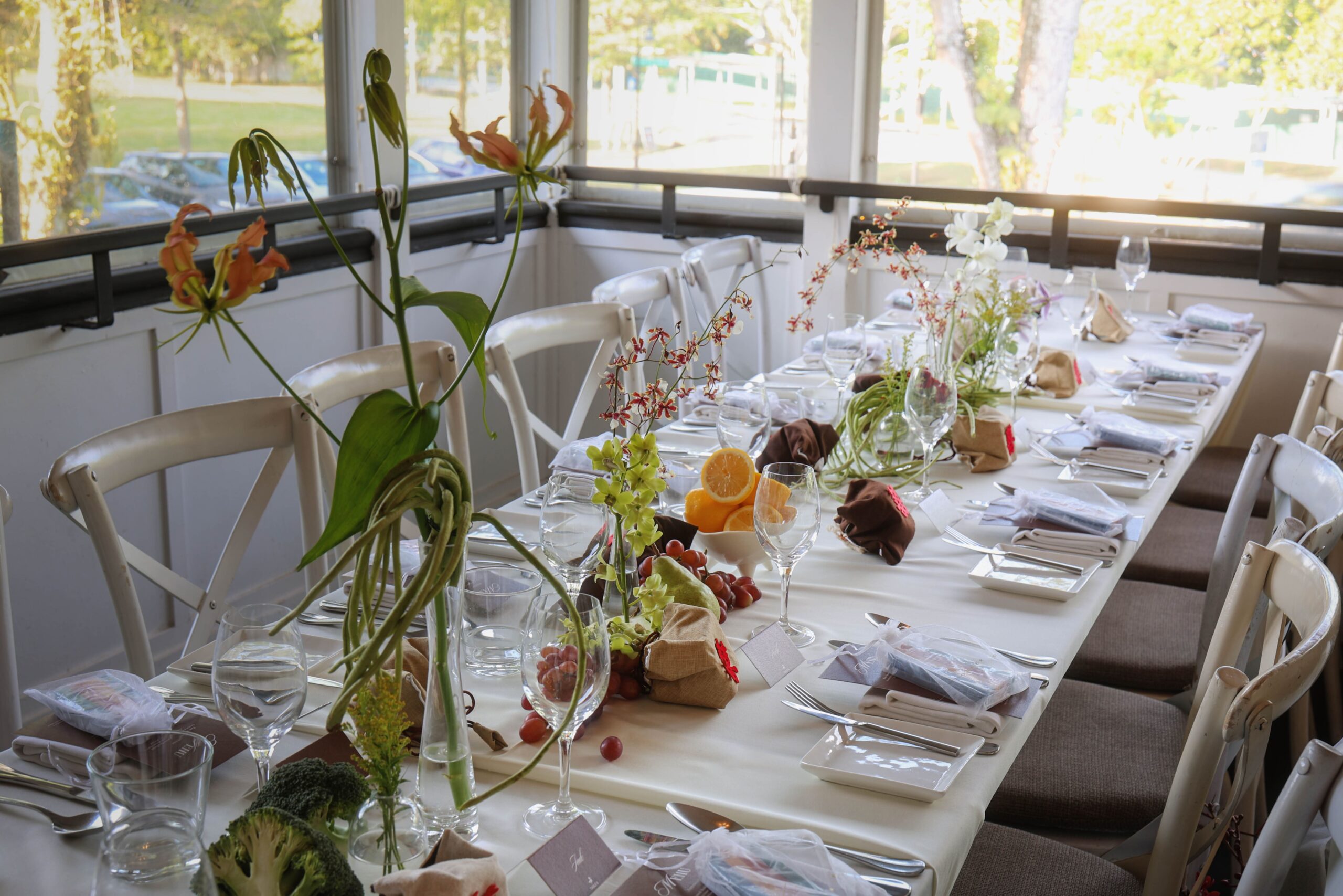 Minimalist wedding table styling with apples, grapes, long beans, and calm floral arrangements at The Summerhouse Restaurant Singapore