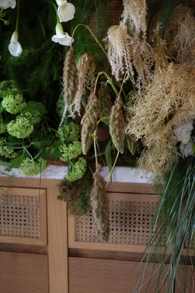 Layered guelder rose clusters, natural dried textures, and cascading botanical styling creating an earthy modern romantic wedding installation at Min Jiang at Dempsey, Singapore
