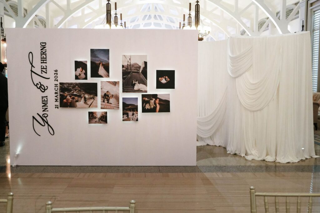 Privacy wall design featuring a curated photo gallery display integrated into wedding decor, The Clifford Pier Singapore