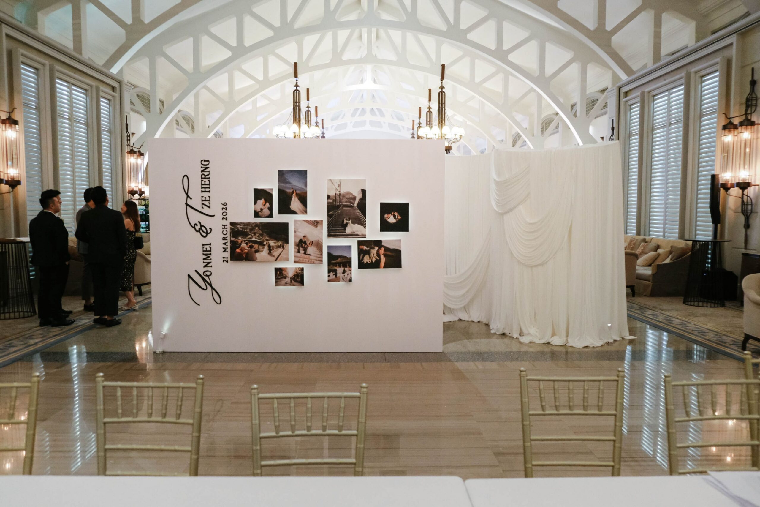 Full venue hero shot of wedding styling with privacy wall design, drapery elements, and floral installations, The Clifford Pier Singapore You’ve reached the Free limit for chats with attachments