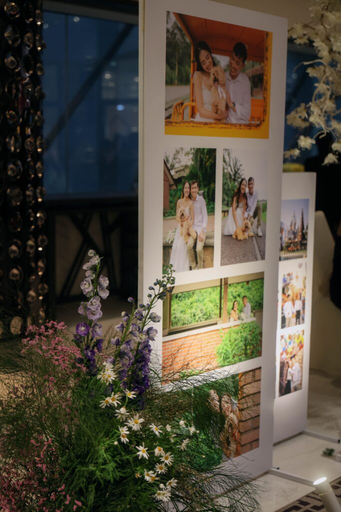 Personalised wedding photo gallery framed with wildflowers, airy foliage, and naturalistic floral arrangements inspired by hiking and travel memories at Westin Singapore.