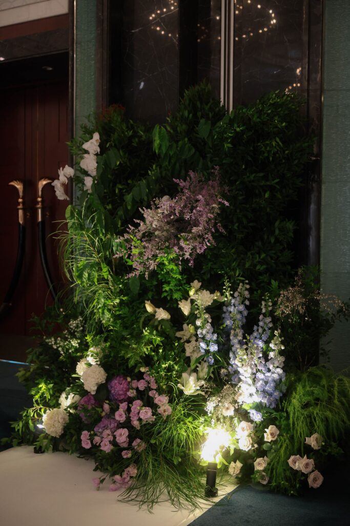 Large floral entrance styling with pastel hydrangeas, soft purple blooms, and natural garden-inspired greenery at Shangri-La Singapore