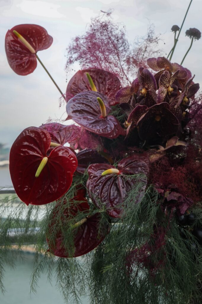 Dark anthurium floral installation at a moody VUE rooftop wedding in Singapore