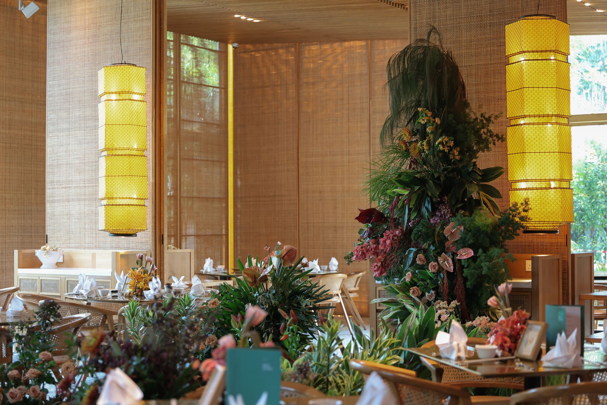 Minjiang restaurant set for a tropical wedding with warm wood and bamboo