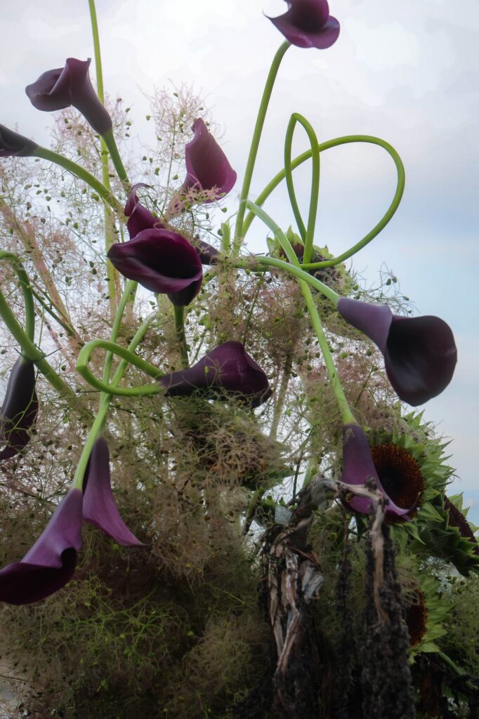 Black calla lily line-work installation at a dark and moody VUE wedding