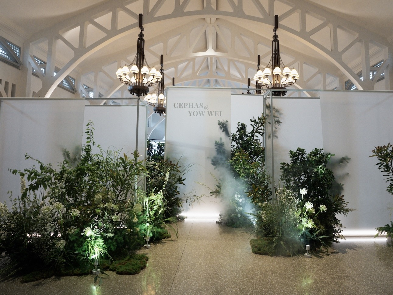 Clifford Pier misty garden wedding with white name panels, greenery and drifting fog, Singapore